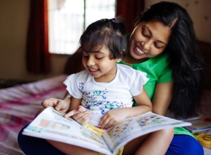 mother and daughter reading a book