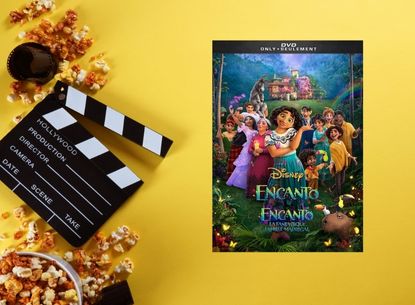 Movie clapperboard and Encanto DVD case