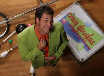 Craig Douglas in a lime green jacket with an orange shirt