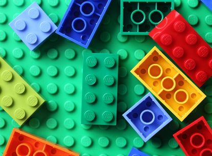 Lego bricks on green background